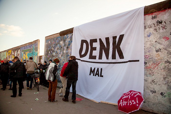 Banners, placards and even umbrellas advertise the East Side Gallery's monument status, 2013