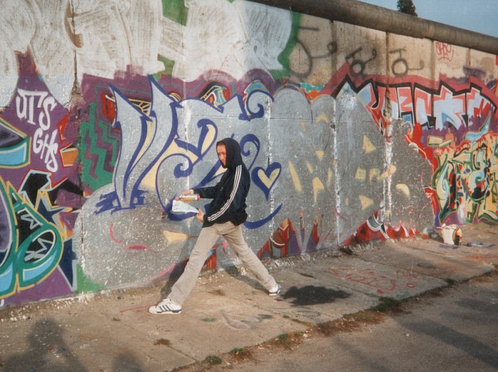 Daniel Kensbock spraying graffiti in the West Side Gallery, 1992