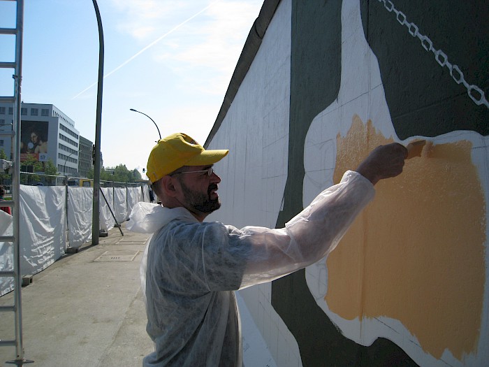 Mikhail Serebryakov restoring his painting, 2009