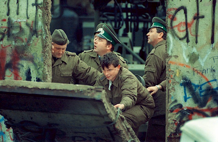 GDR border troops dismantling the Wall at Bernauer Straße, 1990