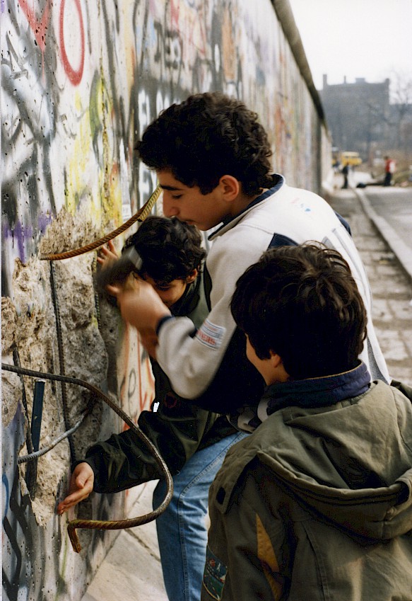 Kreuzberg children and teenagers selling pieces of the Wall as souvenirs, 1990