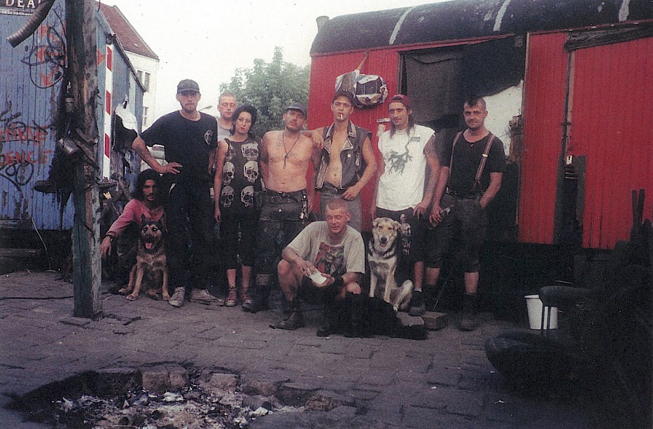 Wagenburg residents Kiki, Godz, Boile, Cris, Ralf, Ferai, Skalp, Triton and Franky in front of their caravans, 1996